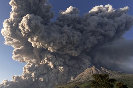 CORRECTS DATE – Mount Sinabung spews volcanic material during an eruption in Karo, North Sumatra, Indonesia, Tuesday, March 2, 2021. The 2,600-metre (8,530-feet) volcano erupted Tuesday, sending volcanic materials a few thousand meters into the sky and depositing ash on nearby villages. (AP Photo/Sastrawan Ginting)